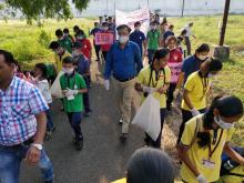 picking polythene bags and garbage  